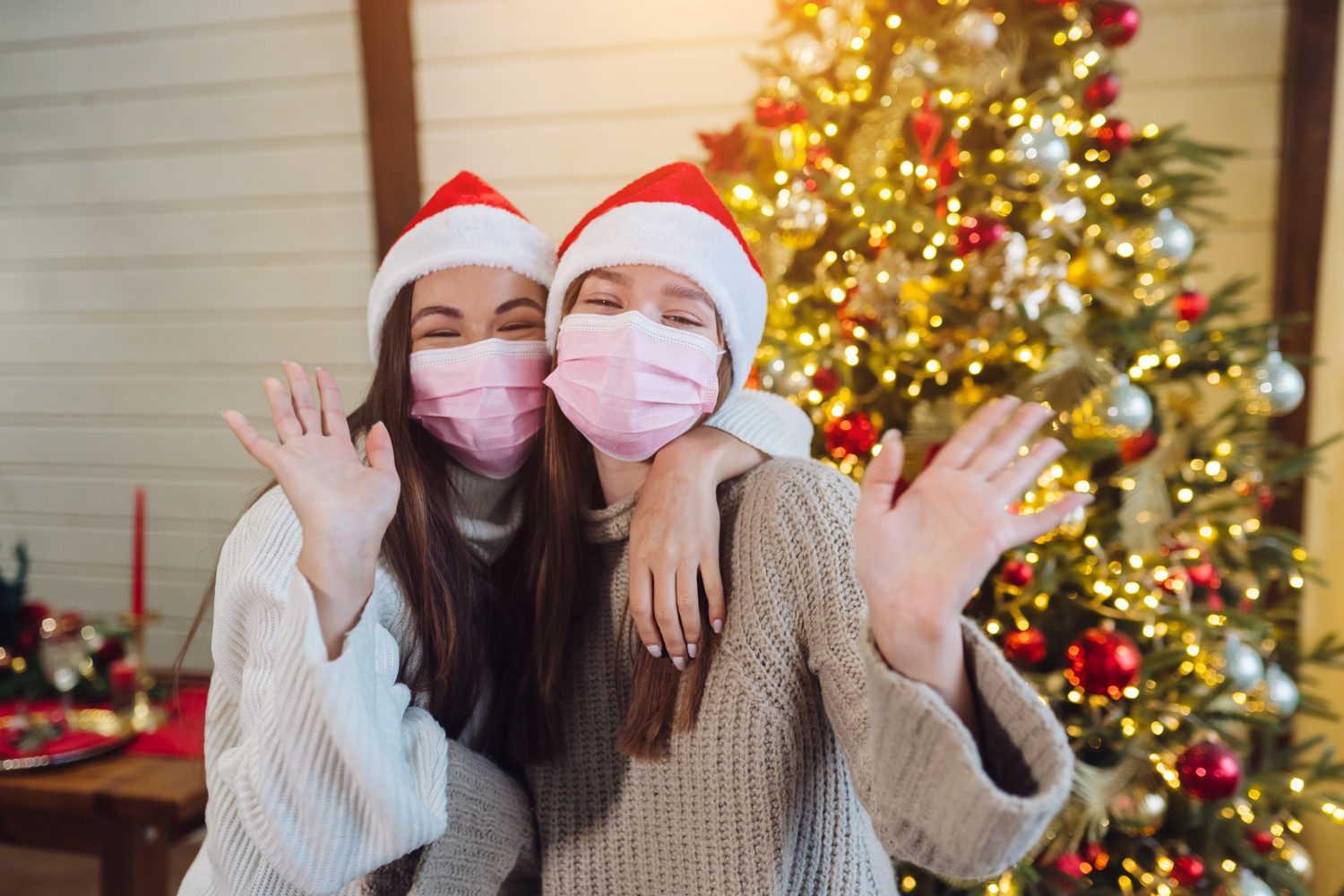 two girls celebrating Christmas with mask